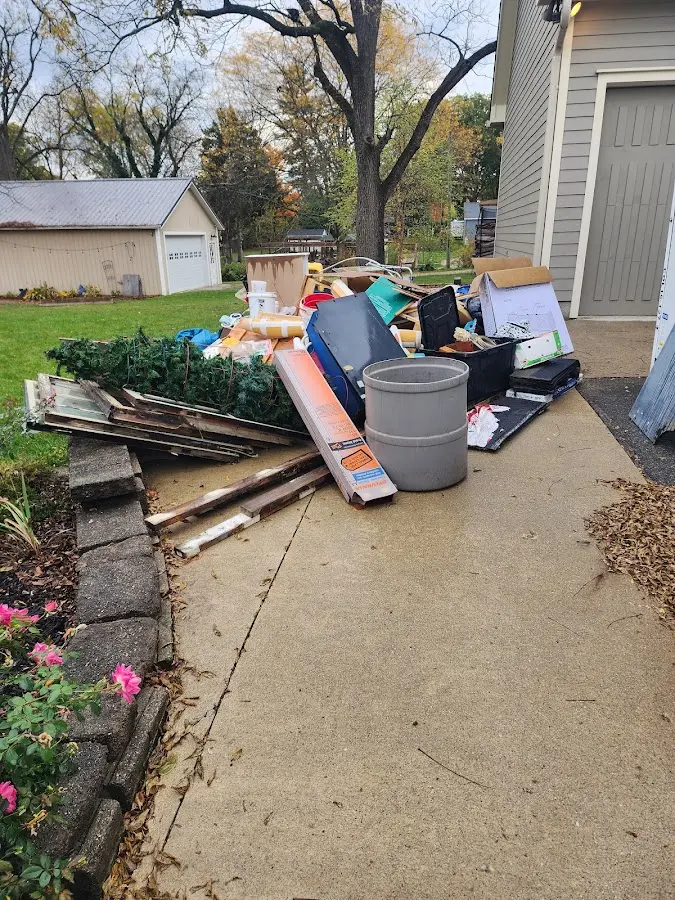 Dumpster being loaded with debris for 30 Yard Dumpster Rental in Lincolnia